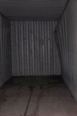 Used 20' or 40' shipping containers - damaged