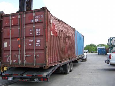 Used 20' or 40' shipping containers - damaged