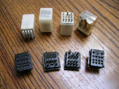 Four, 12 volt dc, relays with mounting connectors, used