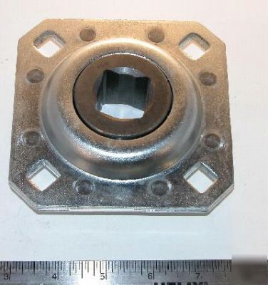 Sealed disc harrow bearing with retainer flanges