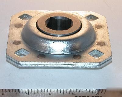 Sealed disc harrow bearing with retainer flanges